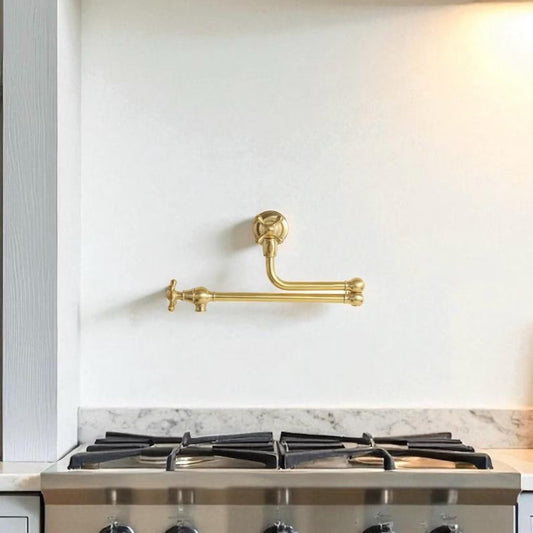 gold faucet under stove kitchen