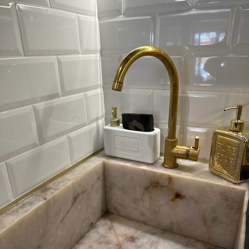 Unlacquered brass single hole sink faucet