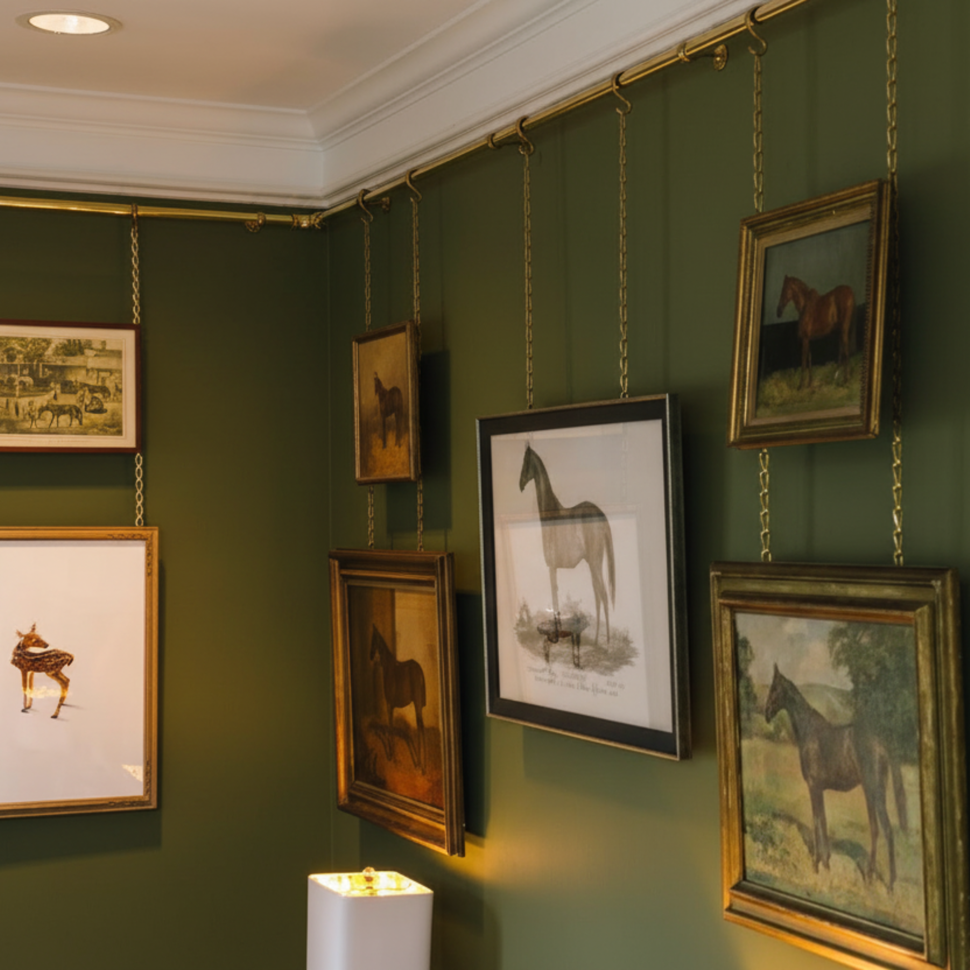 The Brass Picture Rail: A Damage-Free Way to Build a Gallery Wall