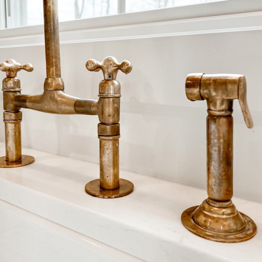 Why the Unlacquered Brass Kitchen Side Sprayer is the Ultimate Living Finish Upgrade