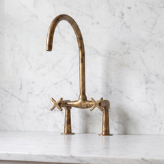 Unlacquered brass kitchen faucet,