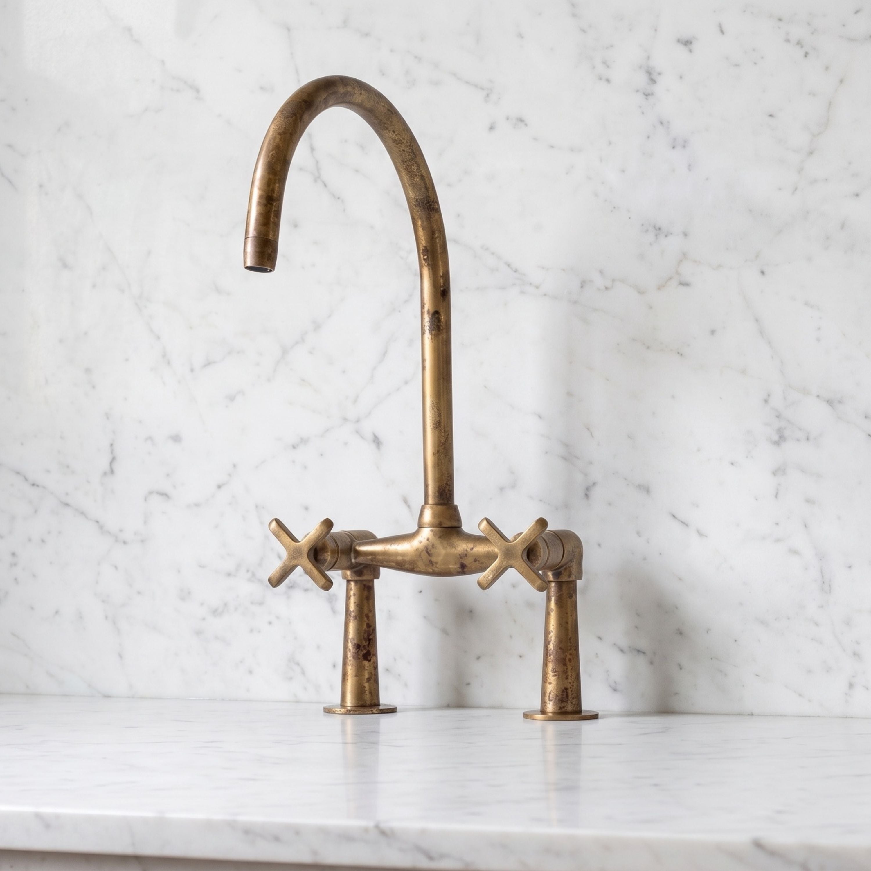 Unlacquered brass kitchen faucet,