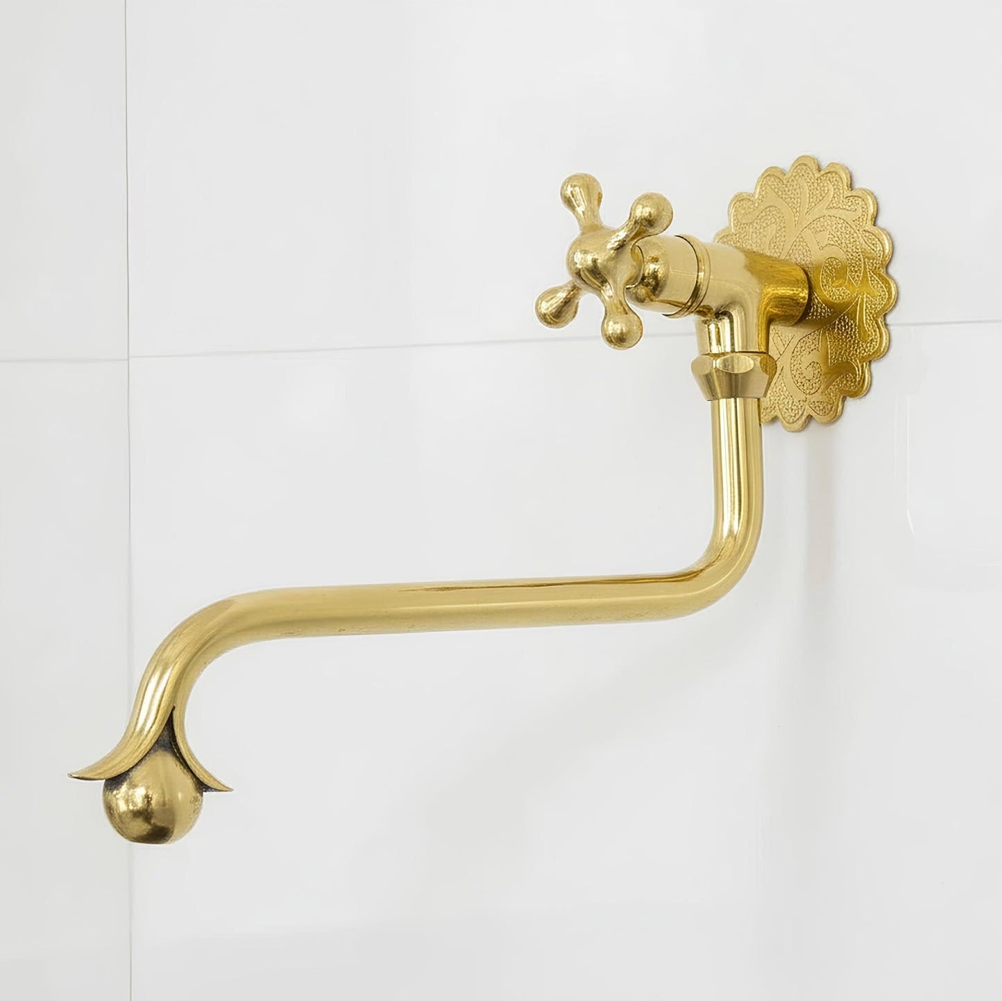 handcrafted Moroccan solid brass pot filler with elegant curved detailing and wall-mounted installation.