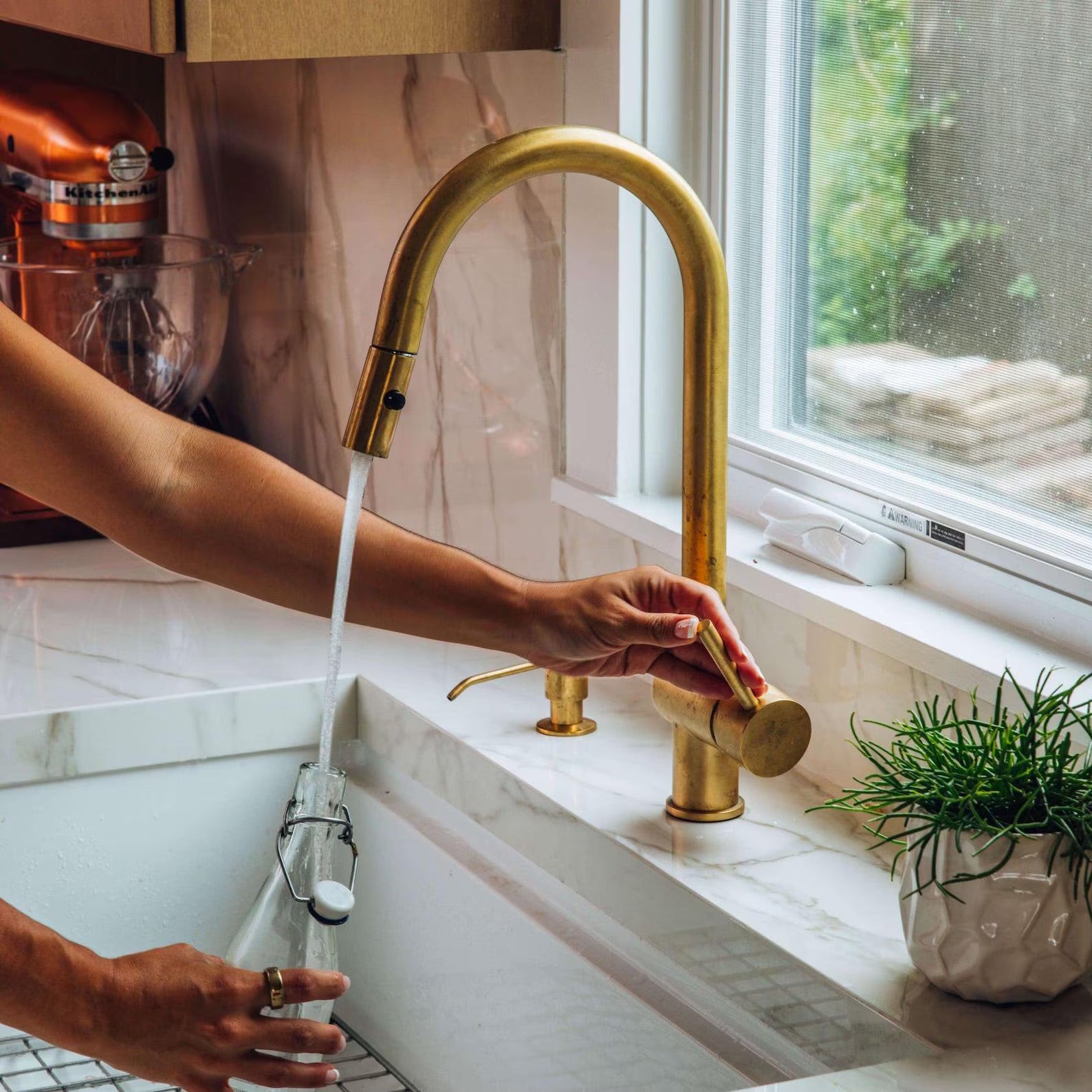 unlacquered brass pull down faucet