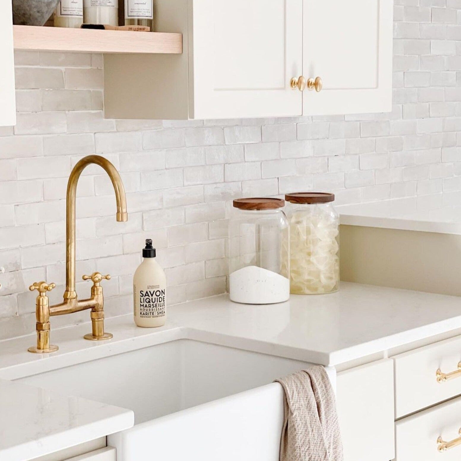 unlaquered brass sink faucet with cross handles