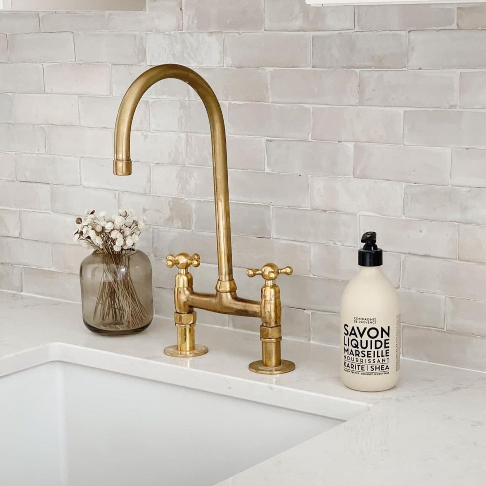 unlaquered brass bridge faucet